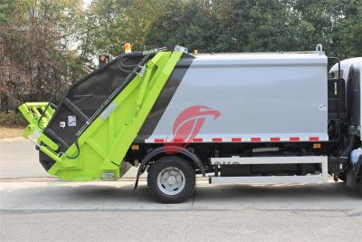 Trash compactor made by Isuzu trucks